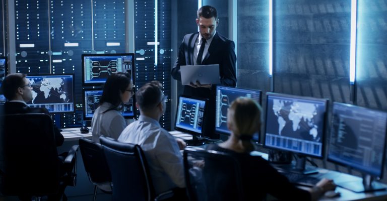 Professional,It,Engineers,Working,In,System,Control,Center,Full,Of